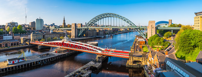 Aerial panorama over the River Tyne between Newcastle and Gateshead overlooking the Swing Bridge, the Tyne Bridge and the Gateshead Millennium Bridge, Tyne and Wear, UK.