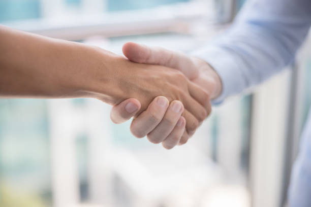 istock Handshake close-up, indoors at daytime 1336063017