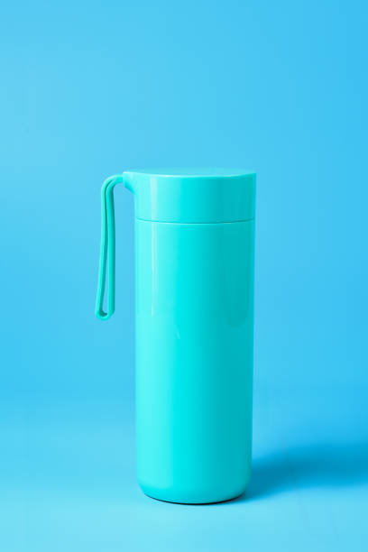 Thermos flask isolated on blue background. Thermos flask isolated on blue background. blue reusable water bottle stock pictures, royalty-free photos & images