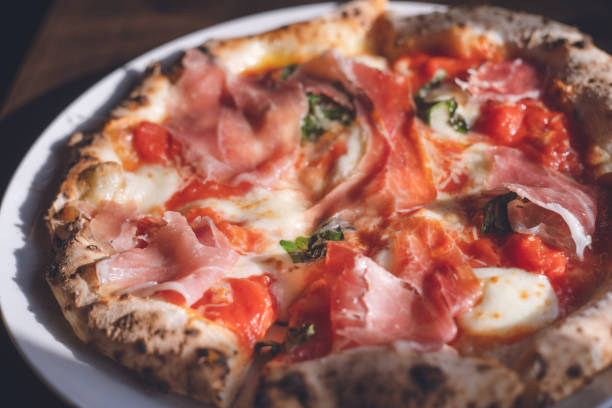 Pizza Margherita with Prosciutto at Stylish Italian Restaurant - Hakodate, Hokkaido stock photo
