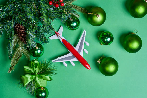 istock Christmas background with decorations and airplane 1336068435