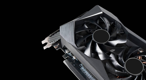 Video card with fan. Gaming graphics card for video games and cryptocurrency mining. Game video card isolated on black background. Electronic device, computer part. GPU card stock photo