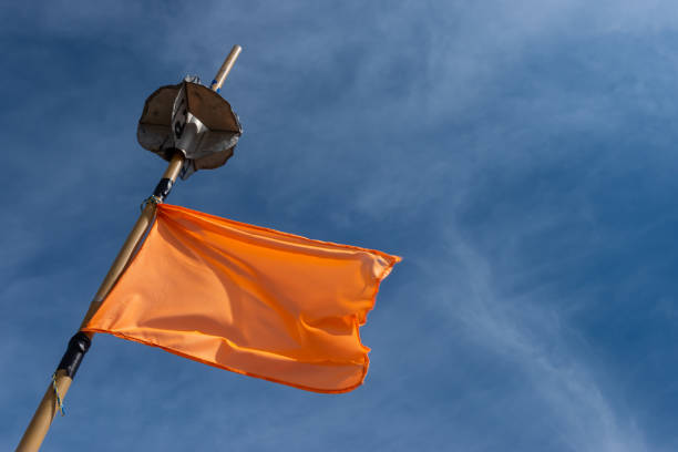 istock An orange fishing net marker flag waving in a high wind. 1336070556