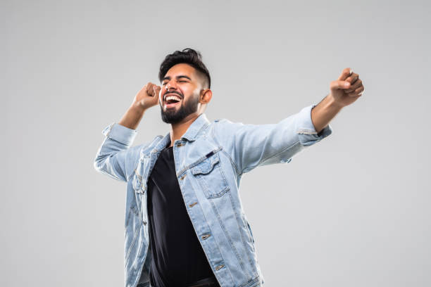 istock Successful man with arms open ver white background 1336071870
