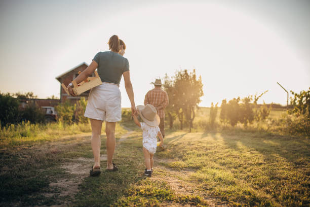 istock Mother and son walking on a farm 1336073376