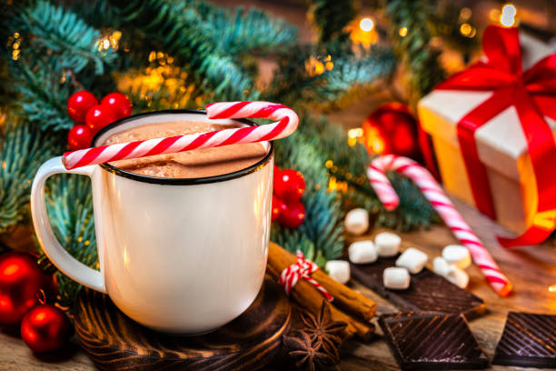 istock Hot chocolate mug and candies on Christmas table 1336074411