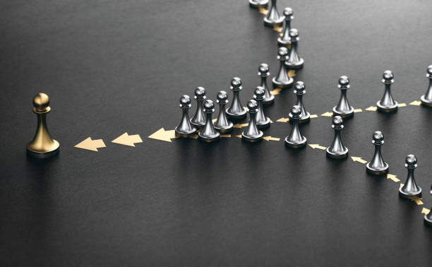 Leader and followers over black background. Good leadership concept. 3D illustration of many pawns in a row over black background. Concept of lead. Following the leader. following stock pictures, royalty-free photos & images