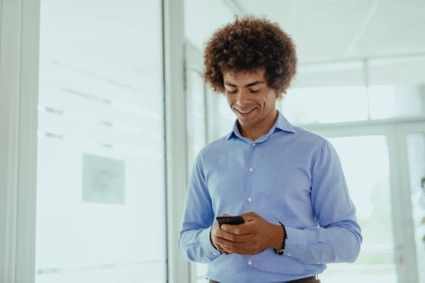 istock African American businessman in office using smart phone 1336077189