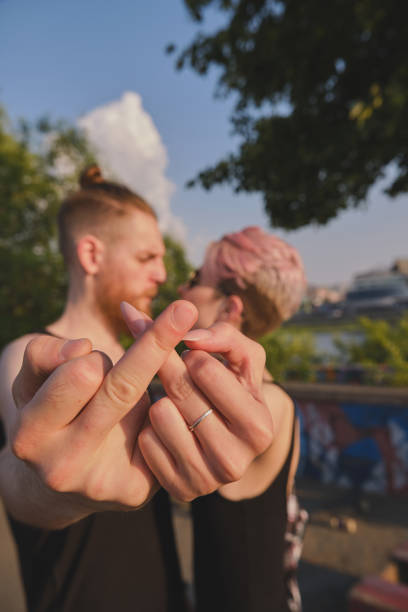 istock Young couple gesturing while kissing 1336079960