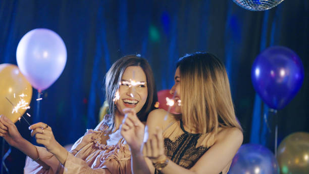 istock Friends enjoying with fire crackers at party 1336084678