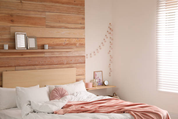 istock Stylish room interior with big comfortable bed 1336086224