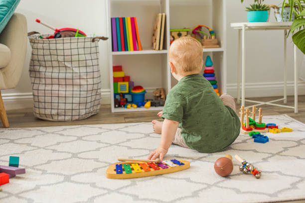 istock Rear View Of Boy Playing With Toy 1336086527