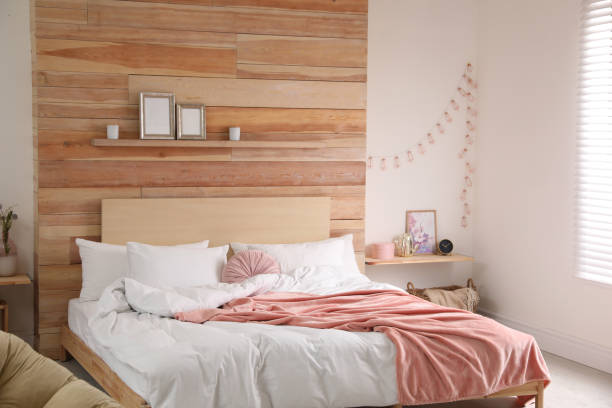 istock Stylish room interior with big comfortable bed 1336086670