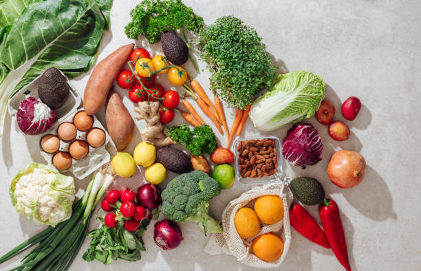 istock Colorful Vegetables and Fruits on Kitchen Desk 1336087719