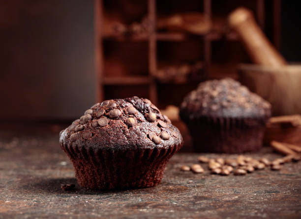 istock Chocolate muffins on a brown background. 1336087771
