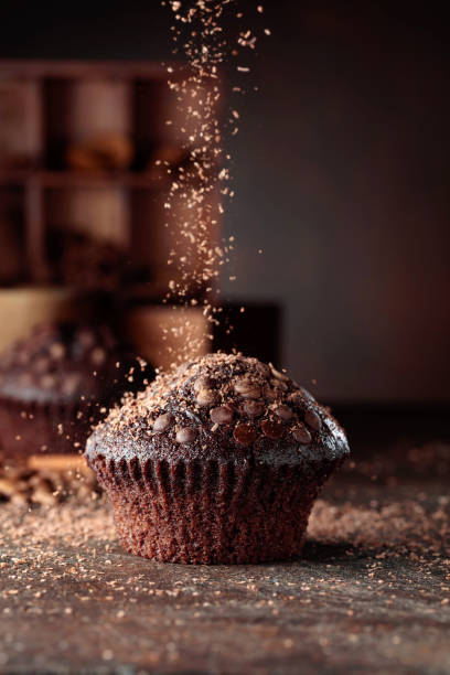 istock Chocolate muffins on a brown background. 1336087772