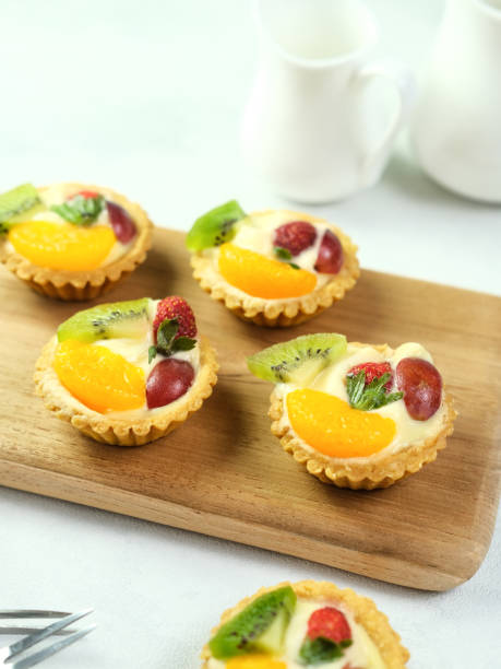 istock Delicious mini pie topped with fresh fruits. 1336088568