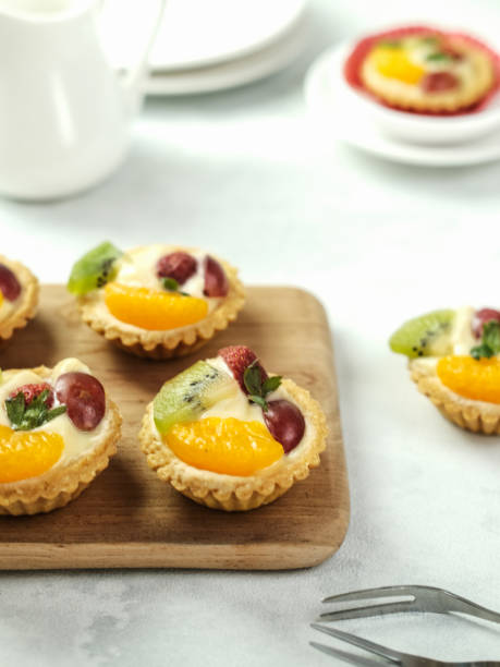 istock Delicious mini pie topped with fresh fruits. 1336088599