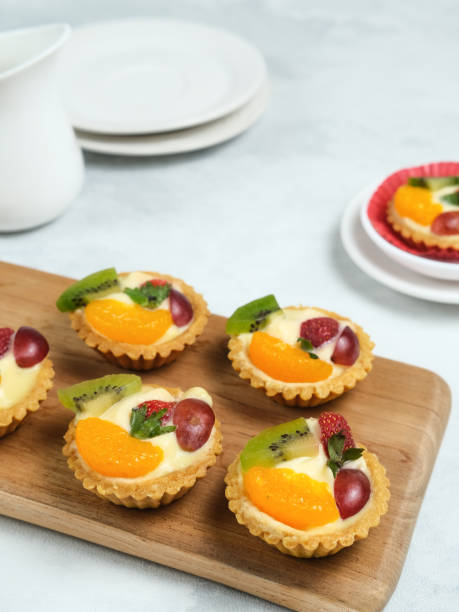 istock Delicious mini pie topped with fresh fruits. 1336088601