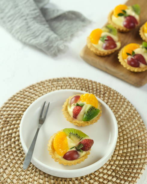 istock Delicious mini pie topped with fresh fruits. 1336088645