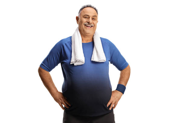 istock Mature man with a towel around his neck smiling at camera 1336095177