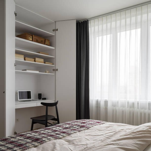 istock Simple bedroom with desk in wardrobe 1336096608