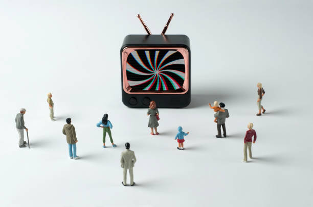 On TV: Hypnosis spiral 1 People figurines watching hypnosis spiral on TV. Post-truth concept big brother orwellian concept stock pictures, royalty-free photos & images