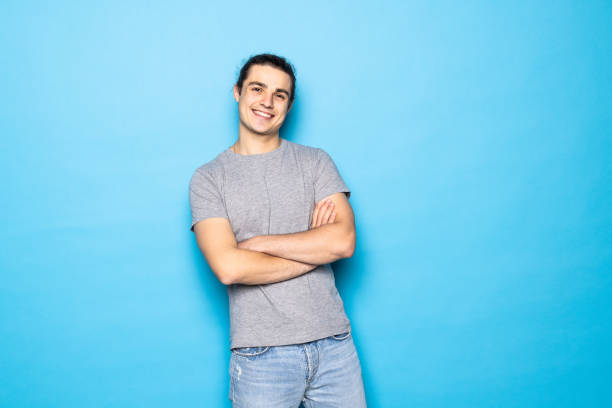 istock Smiling handsome man isolated on blue studio background 1336099906