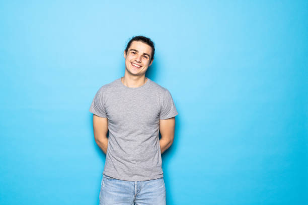 istock Portrait of a young man in a studio on a blue background. 1336099963