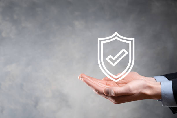 istock Protection network security computer in the hands of a businessman. business, technology, cyber security and internet concept - businessman pressing shield button on virtual screens Data protection 1336100690