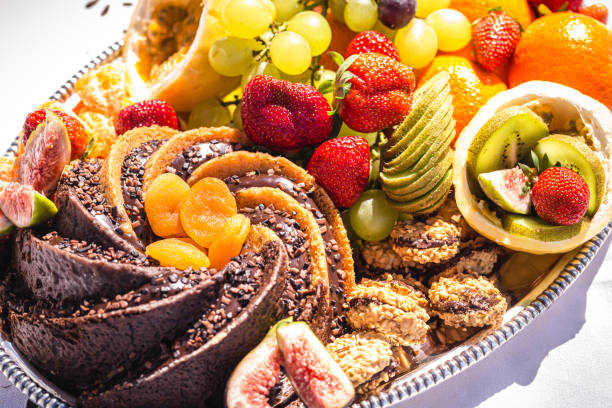 istock fresh fruit, orange, kiwi, grapes and strawberry sliced picnic 1336107657