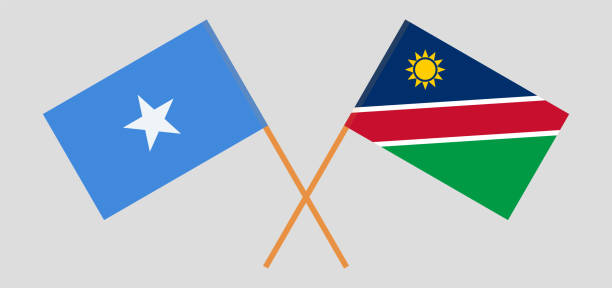 gekreuzte flaggen von somalia und namibia. offizielle farben. korrekte proportion - mogadischu stock-grafiken, -clipart, -cartoons und -symbole