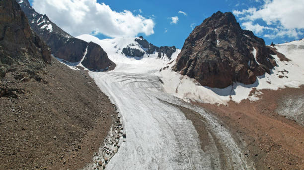 istock High rocky mountains covered with ice in places 1336109488