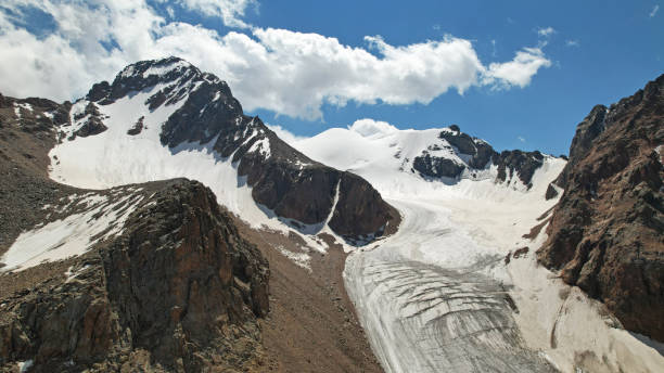 istock High rocky mountains covered with ice in places 1336109508