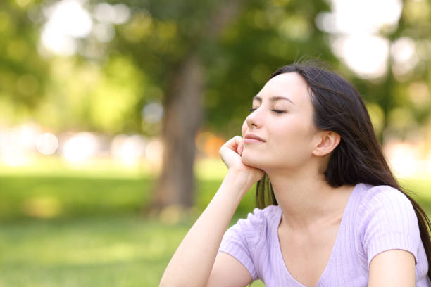 istock Asian woman resting relaxing in a park 1336109522