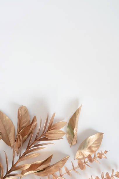 istock Gold tropical palm leaves Monstera on white background. Flat lay 1336110453
