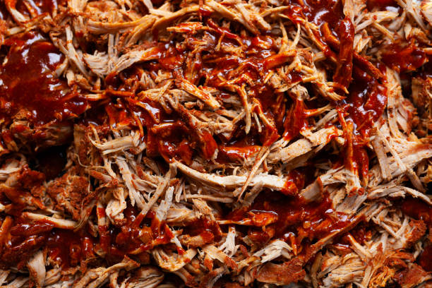 istock Homemade pulled pork with barbecue sauce on top of it, top view 1336111202