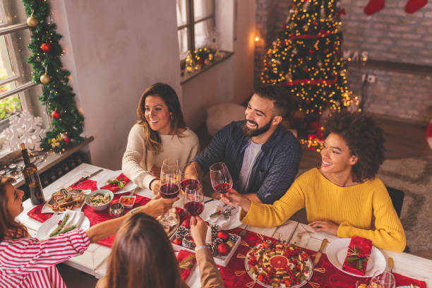istock Friends making a toast over Christmas dinner 1336113835