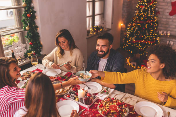 Friends celebrating Christmas together stock photo