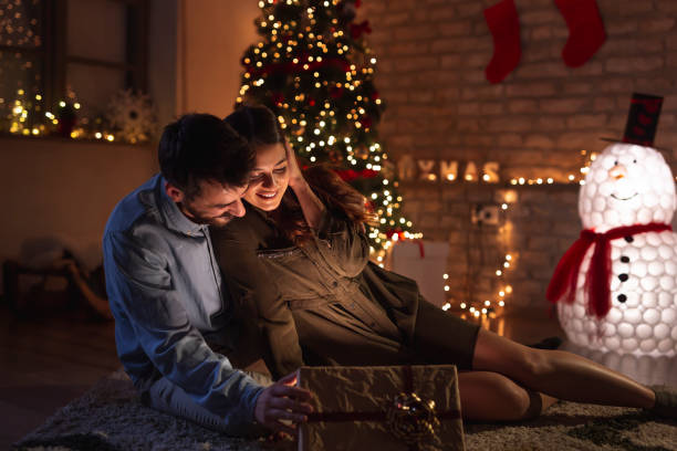 istock Couple spending Christmas Eve at home 1336114170