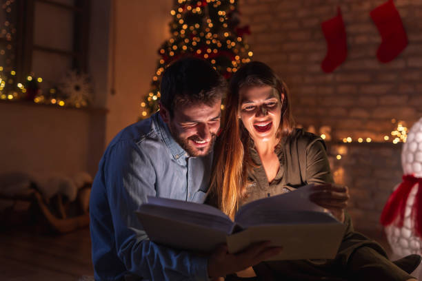 istock Couple looking old photos on Christmas Eve 1336114209
