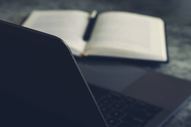 istock Concept of working or using laptop and studying or leaning book 1336115641