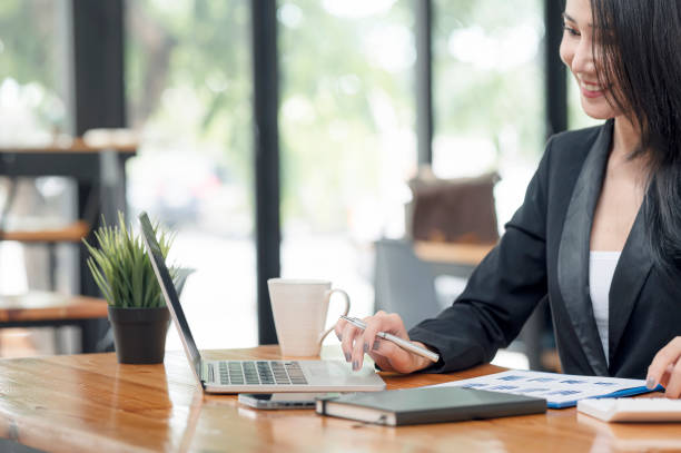 istock Businesswoman hand working on laptop computer and document. 1336115790