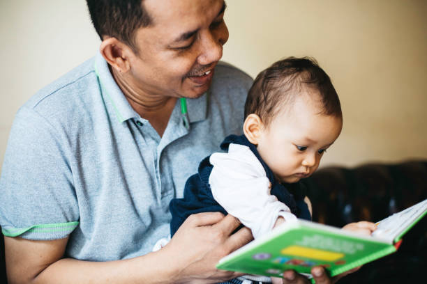 istock A father reading to his baby boy. 1336116703