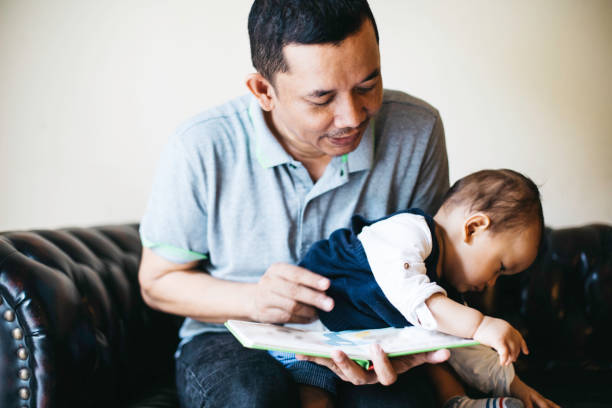 istock A father reading to his baby boy. 1336116782