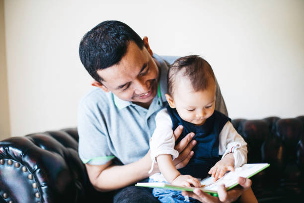 istock A father reading to his baby boy. 1336116796