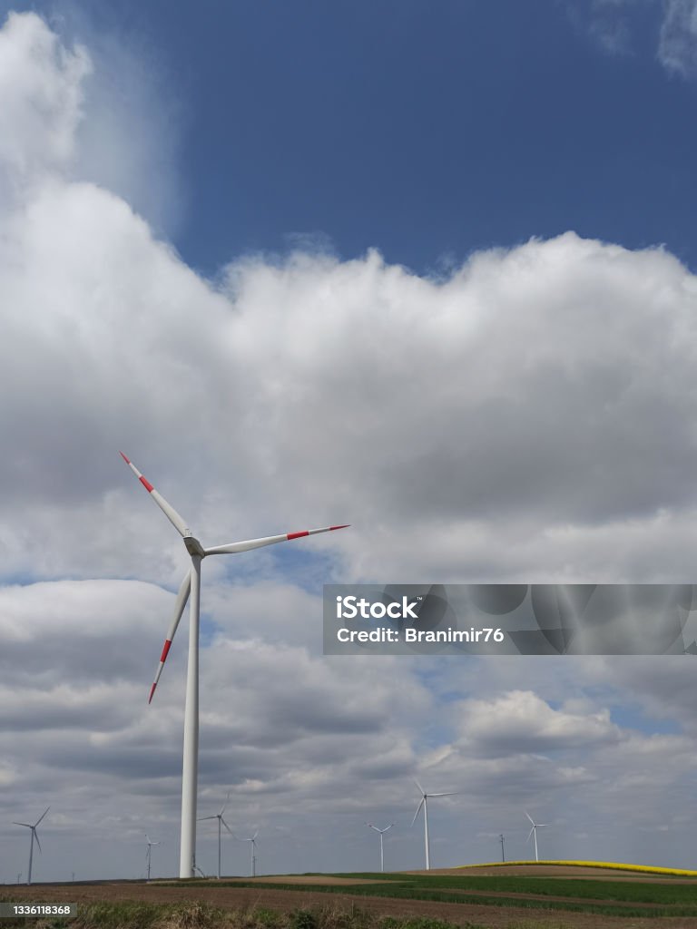 Windmills-making power Xiaomi mobile phone photography. Photos of Windmills with beautiful clouds. Blue Stock Photo