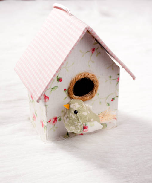 istock bird in a nest fabric house with round window 1336118380