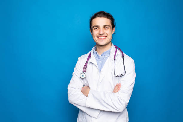 istock Male doctor man isolated on blue background. 1336119819