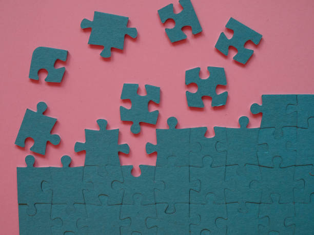 istock A set of puzzles, the process of collecting in a large pattern. Teamwork and problem solving, concept. 1336121535